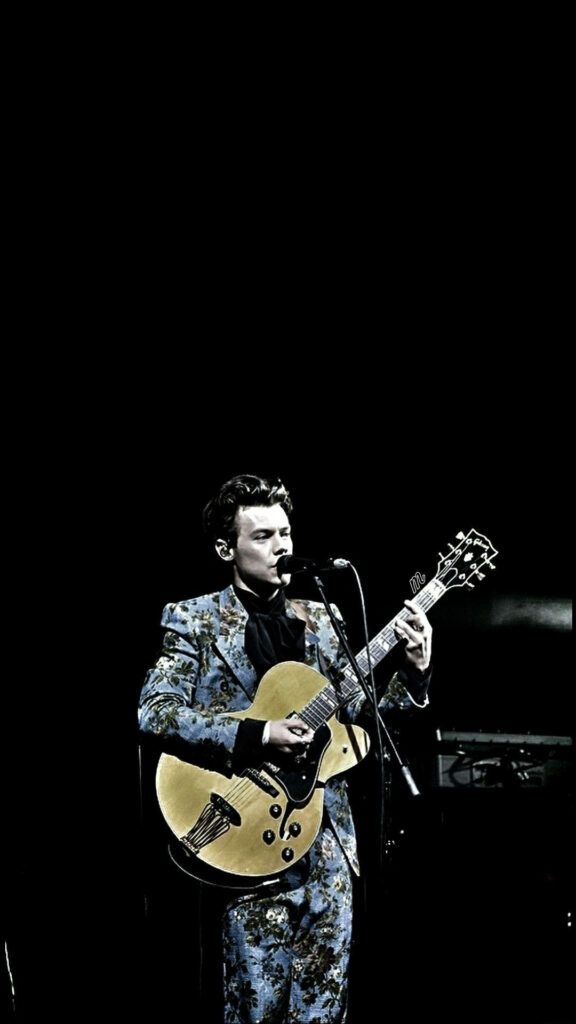 Harry Styles Floral Suit Wallpaper for iPhone: Stylish Stage Performance