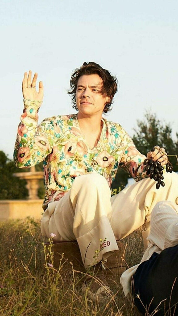 Harry Styles in Floral Polo: Fresh Outdoor Vibe Wallpaper Background