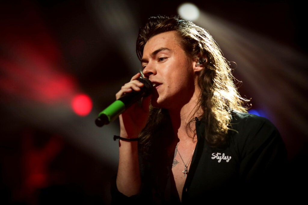 Curly Sensation: Harry Styles' Mesmerizing Long Hair Wallpaper