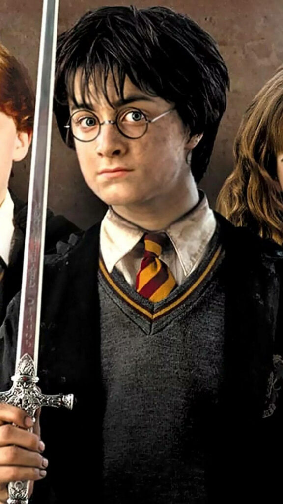 Harry's Heroic Pose: Sword of Gryffindor Shines in Harry Potter iPhone Wallpaper