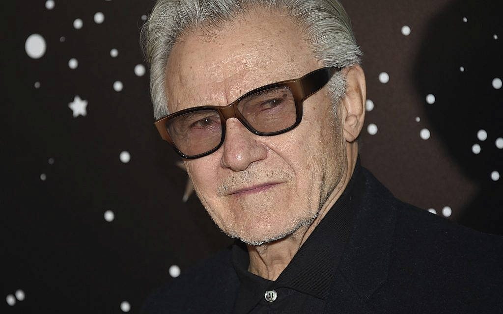 Close-up of actor Harvey Keitel wearing glasses black shirt dark starry background wallpaper