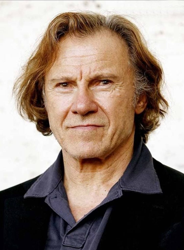 Harvey Keitel intense portrait headshot in dark jacket with soft light background professional wallpaper