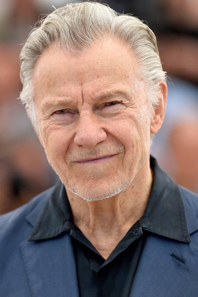 Harvey Keitel portrait with white hair navy blazer black shirt soft-focus background wallpaper