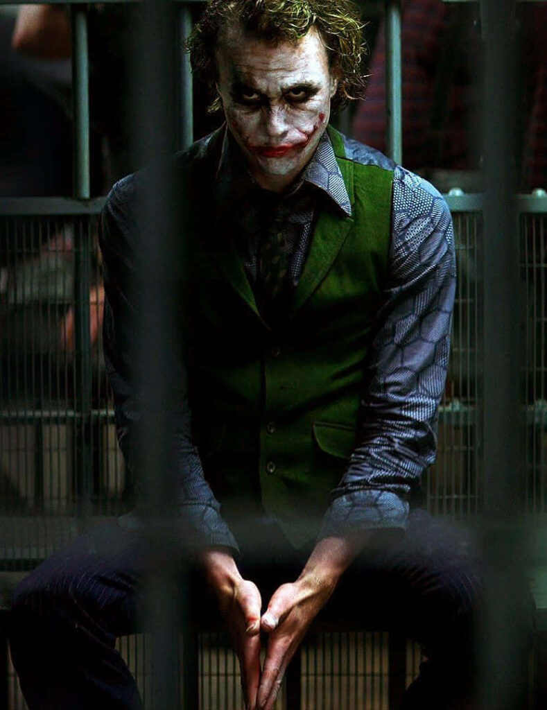 Joker in Jail: Haunting Wallpaper Background with Iconic Makeup