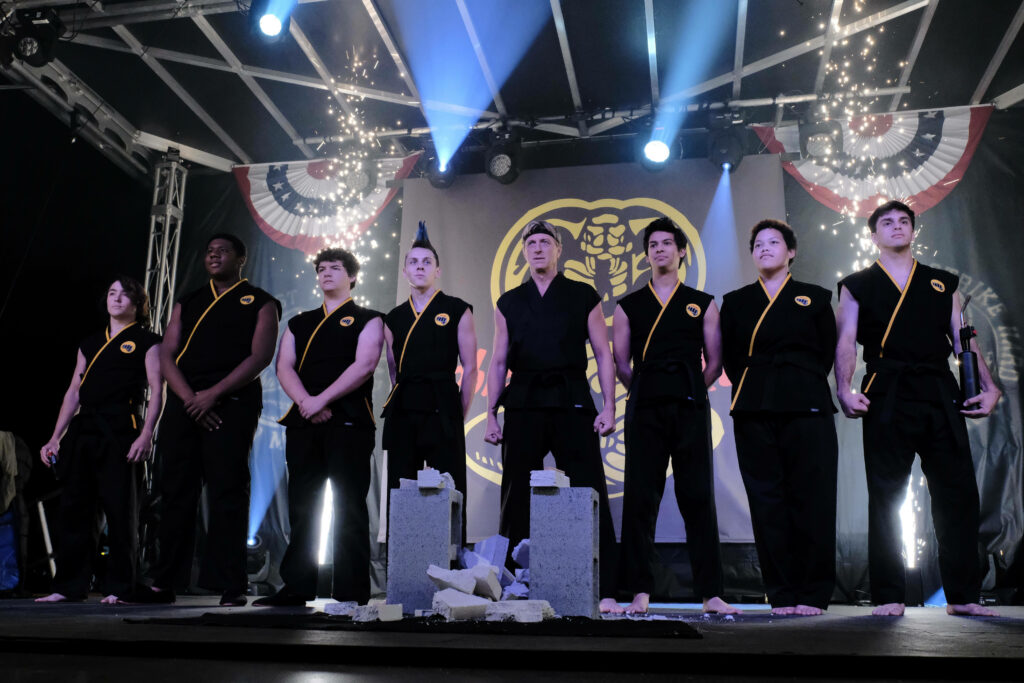 Dynamic Cobra Kai Wallpaper: Hawk & Characters in Epic Formation