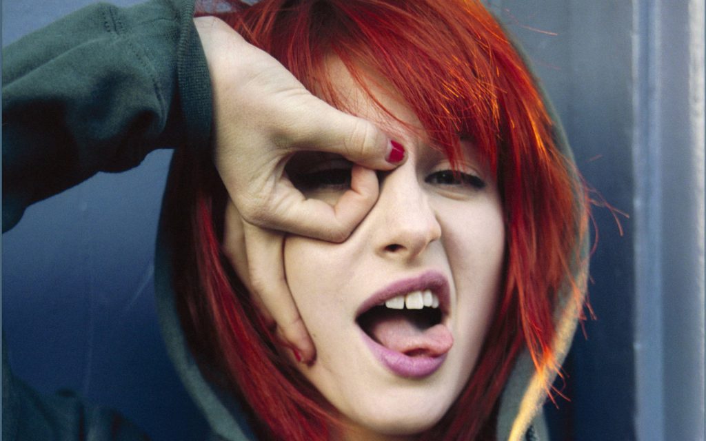 Hayley Williams close-up wallpaper red hair casual hoodie playful pose over eye candid photo