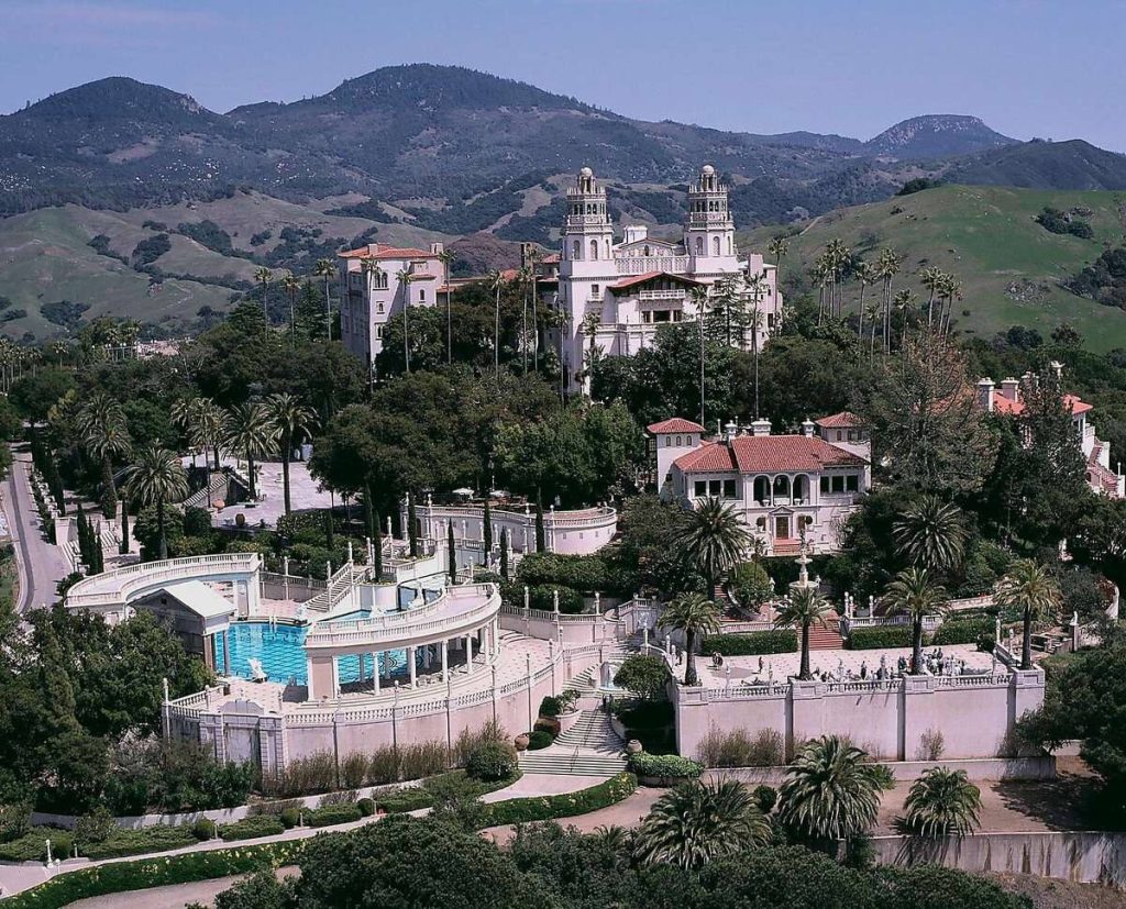 Aerial view of Hearst Castle Casa Grande Neptune Pool palm gardens San Simeon hills wallpaper