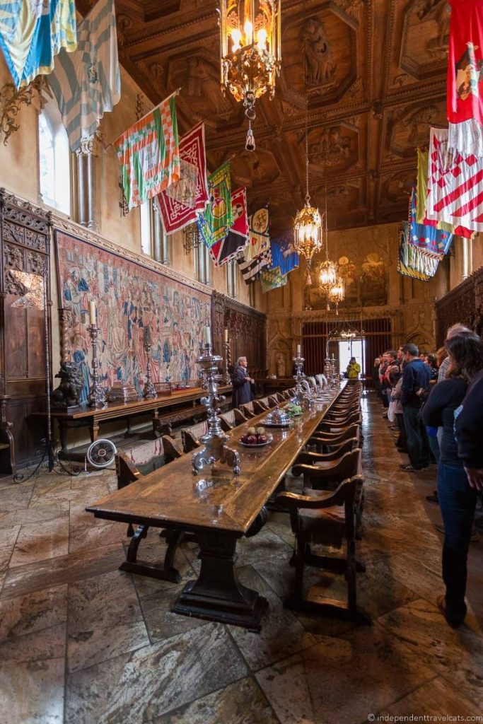 Hearst Castle Dining Room historic Refectory wooden table chandeliers banners tapestries wallpaper