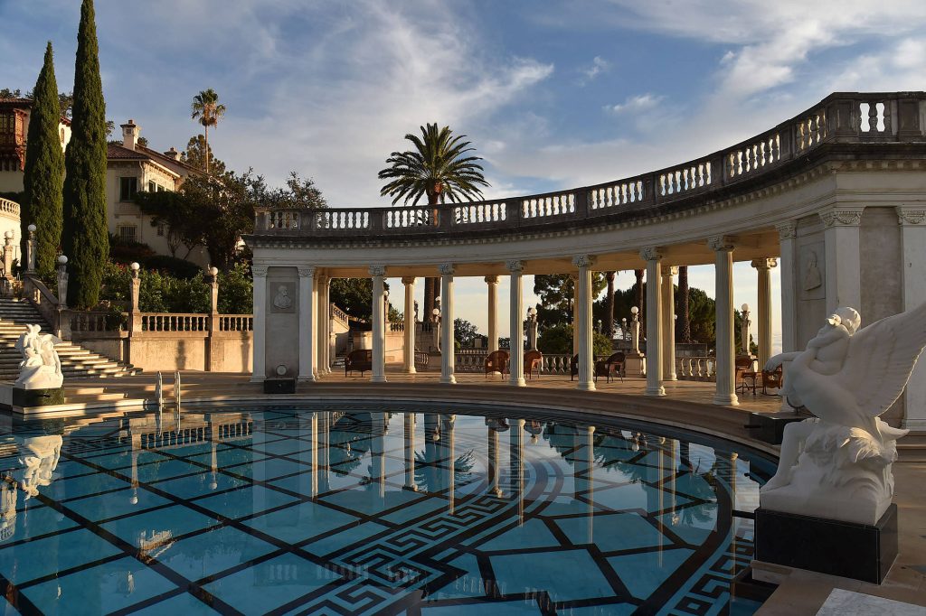 Hearst Castle Neptune Pool at sunset with marble statues curved colonnade and geometric tiles Wallpaper