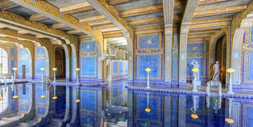 Hearst Castle Roman Pool with blue gold mosaics classical statues and indoor water reflections wallpaper