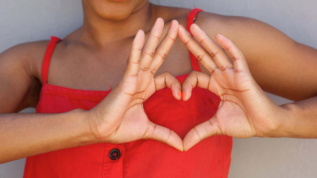 Heart Shape of Love: Person in Red Top - Wallpaper Background