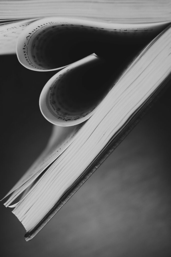 Heart-Shaped Book Pages Wallpaper: Love Through Literature Background