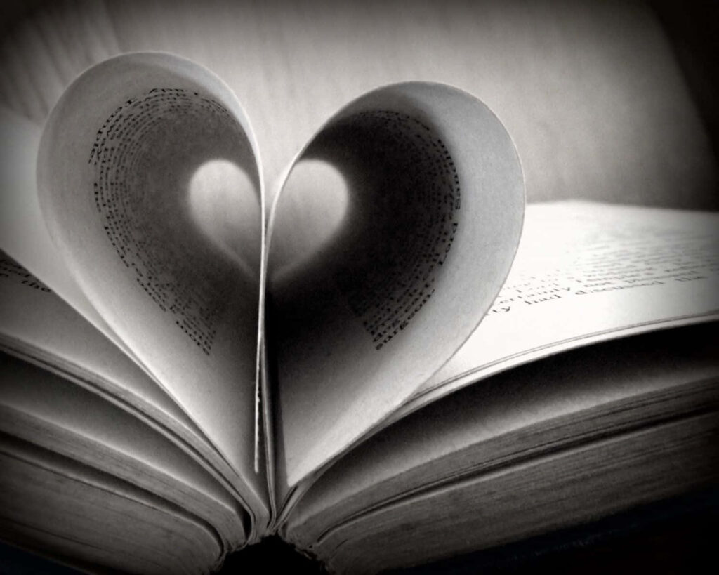 Heart-Shaped Book Pages: Timeless Love for Literature Wallpaper
