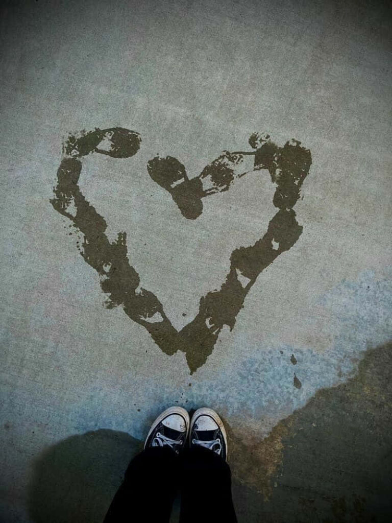Heart-Shaped Footprint Pattern Wallpaper: Meaningful Concrete Scene