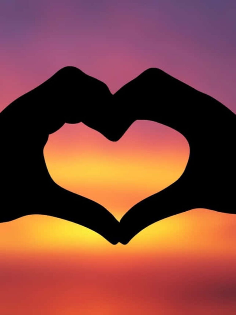 Heart-Shaped Hands Wallpaper: Romantic Sunset Sky Background