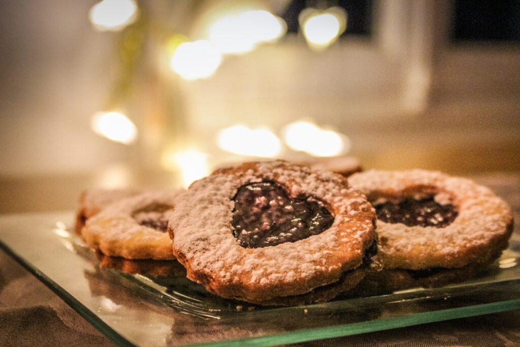 Heart-Shaped Jam Pastries: Sweet Glass Plate Wallpaper Background