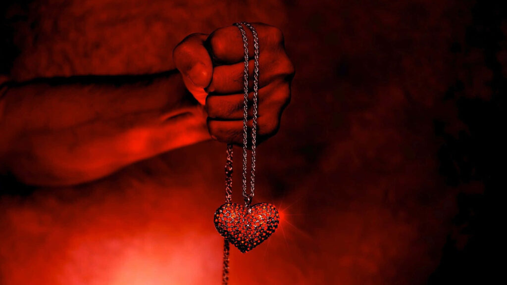 Passionate Heart Necklace on Fiery Red Background - Stunning Wallpaper