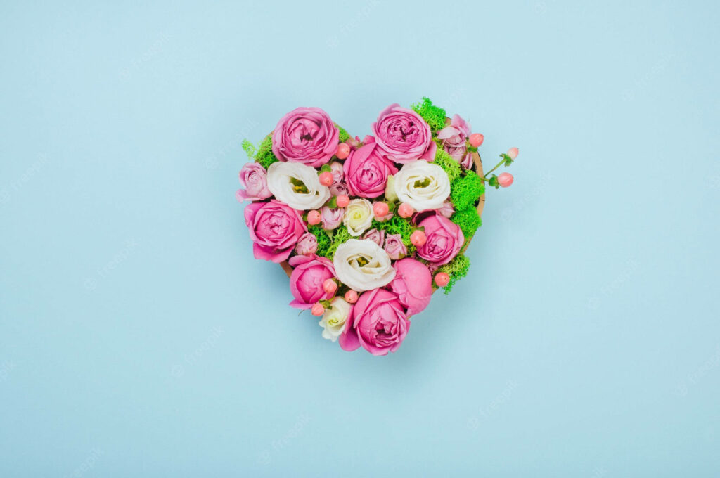 Charming Heart-Shaped Rose Wallpaper on Light Blue Background