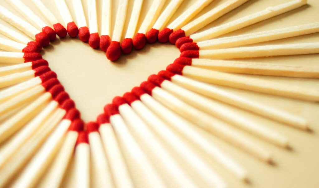Artistic Red-Tipped Matches Heart Design Wallpaper Background