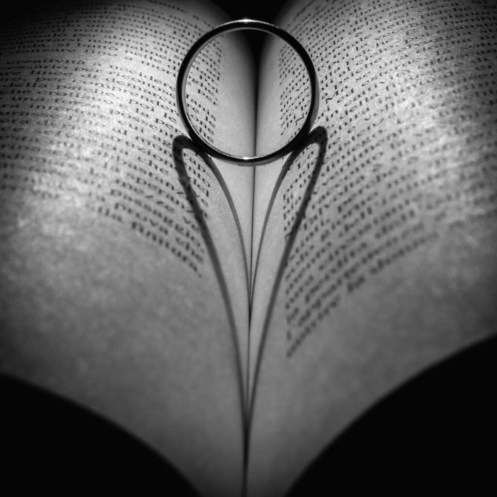 Romantic Monochrome Wallpaper: Heart Shadow on Open Book Background