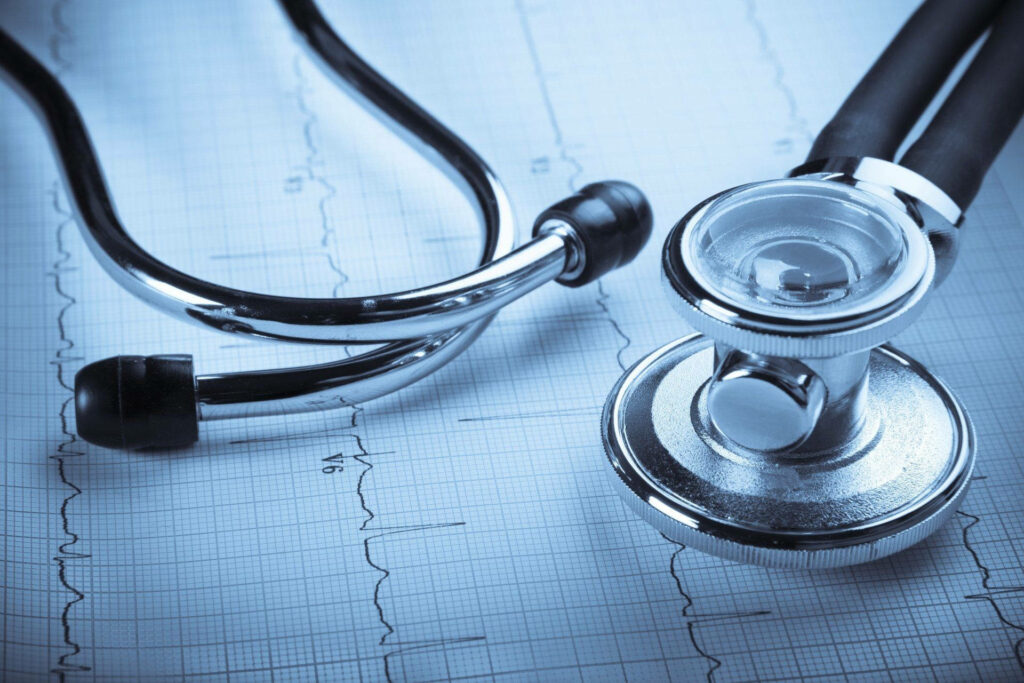 Medical Diagnostic Essentials: MBBS Heart Specialist's Background with Stethoscope and ECG Graph Wallpaper