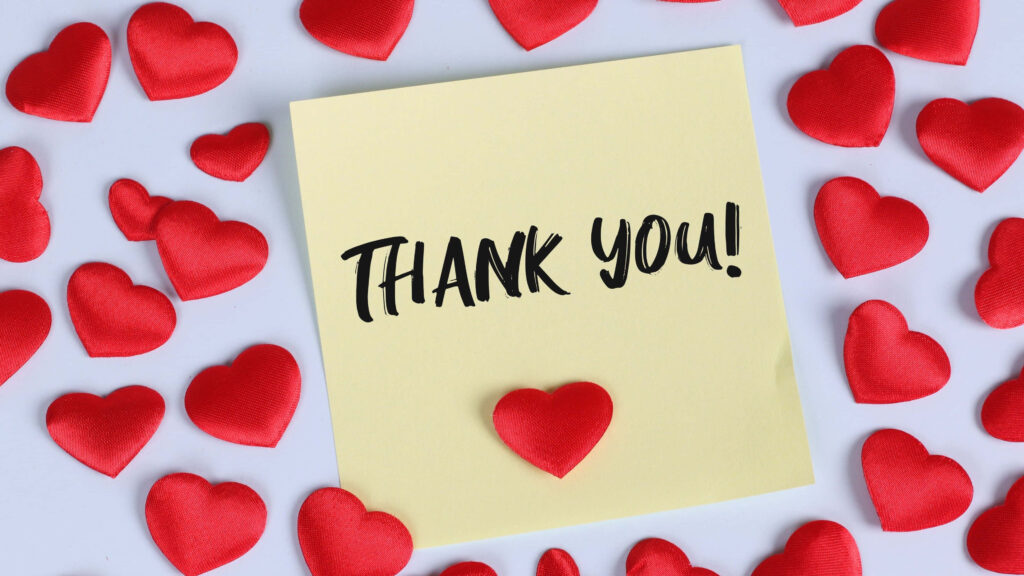 Heartfelt Yellow Thank You Note Wallpaper with Vibrant Red Hearts
