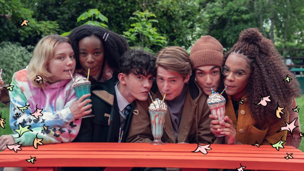 Heartstopper wallpaper with Nick Charlie Tara Darcy Tao Elle enjoying milkshakes at picnic table
