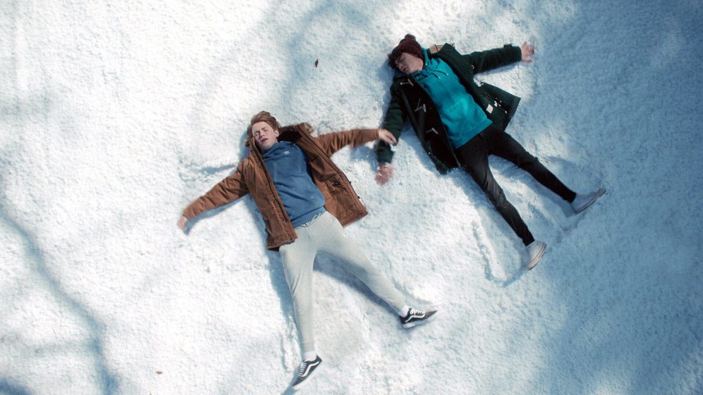 Heartstopper wallpaper Nick Nelson Charlie Spring making snow angels in cozy winter snow