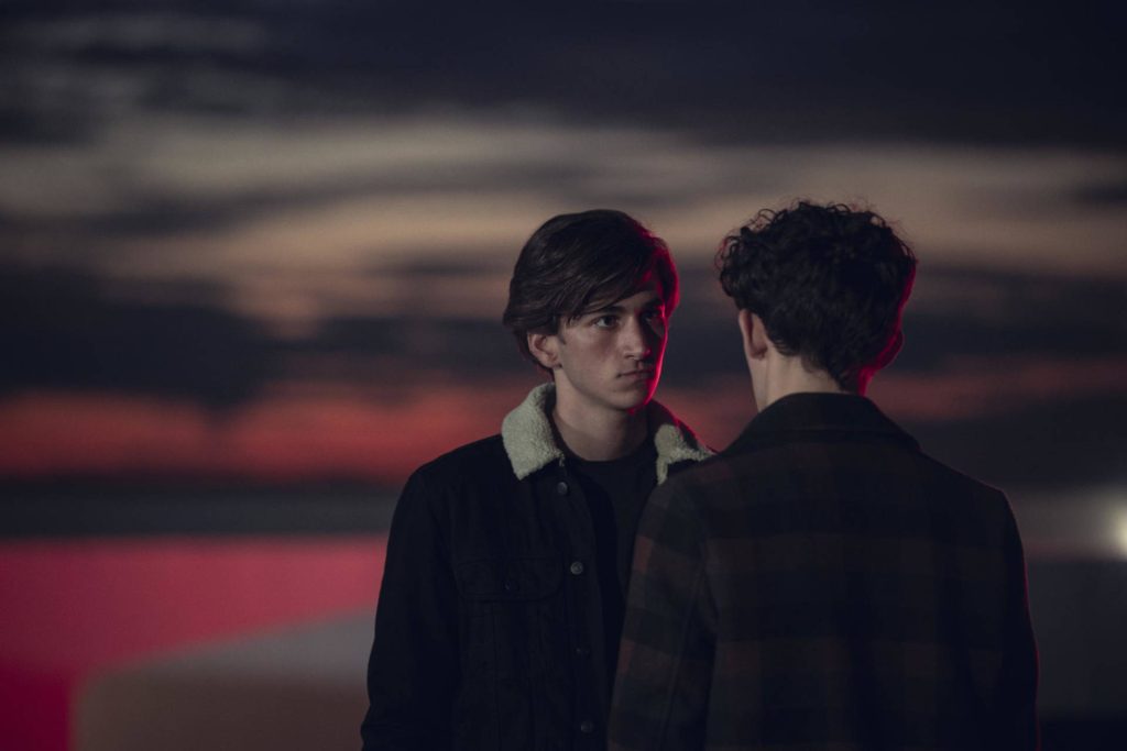 Heartstopper wallpaper with Ben Hope and Charlie Spring under moody red twilight sky