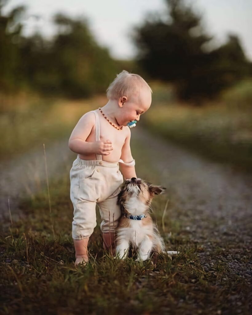 Charming Baby and Puppy on Rustic Path - Heartwarming Wallpaper
