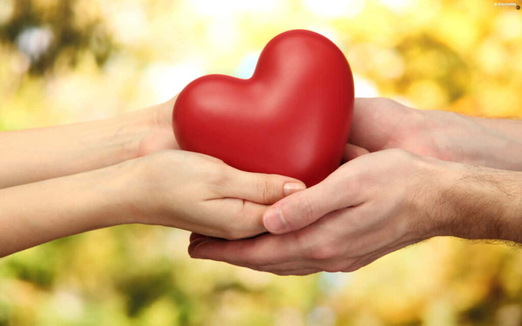 Heartwarming Couple Sharing Love: Gentle Wallpaper Background