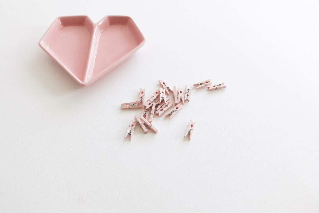 Pink Love: Captivating Aesthetic Desktop Background with Heart-shaped Plate on a Serene White Canvas Wallpaper