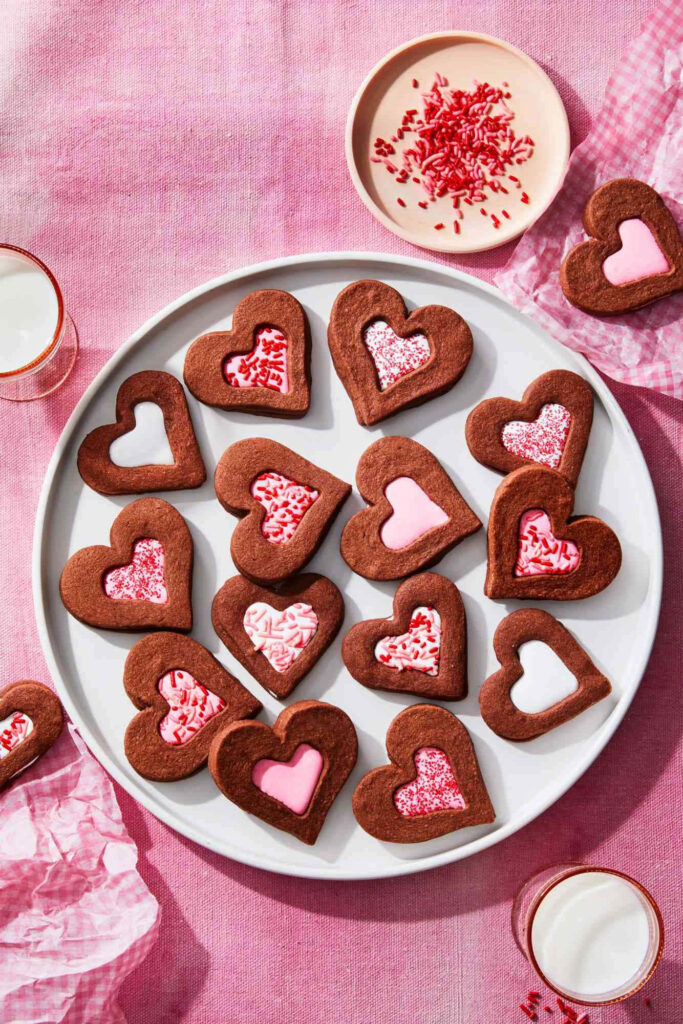 Tempting Valentine Heart Cookies Tantalizingly Arranged on a Tablecloth of Blushing Pink Wallpaper