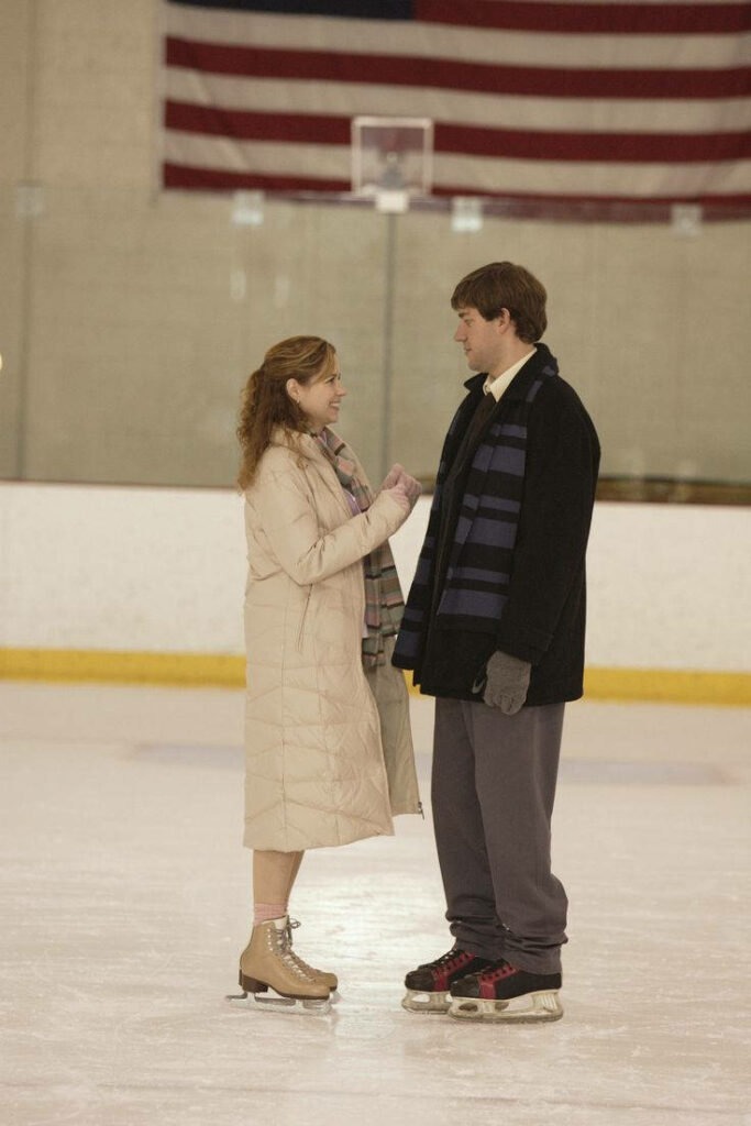 Heartwarming Office Scene: Ice Skating iPhone Wallpaper Background