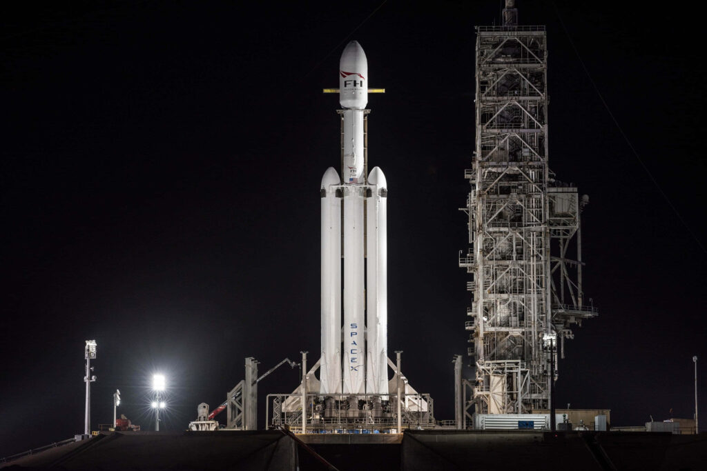 Heavy Space Rocket Wallpaper: Launch Pad Night Sky Background