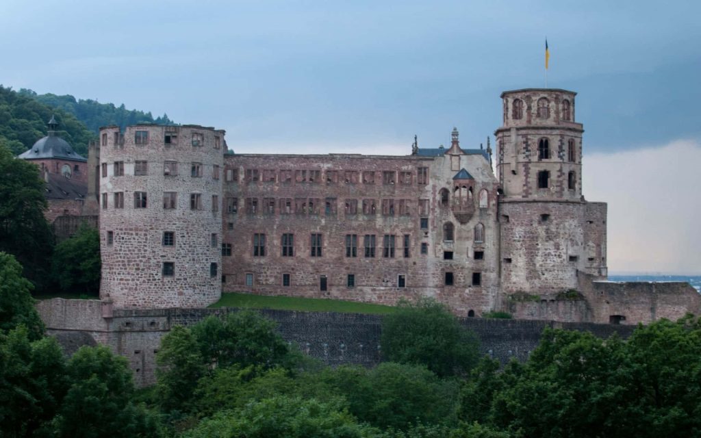 Heidelberg Castle ruins red sandstone towers lush greenery overcast sky Renaissance fortress wallpaper
