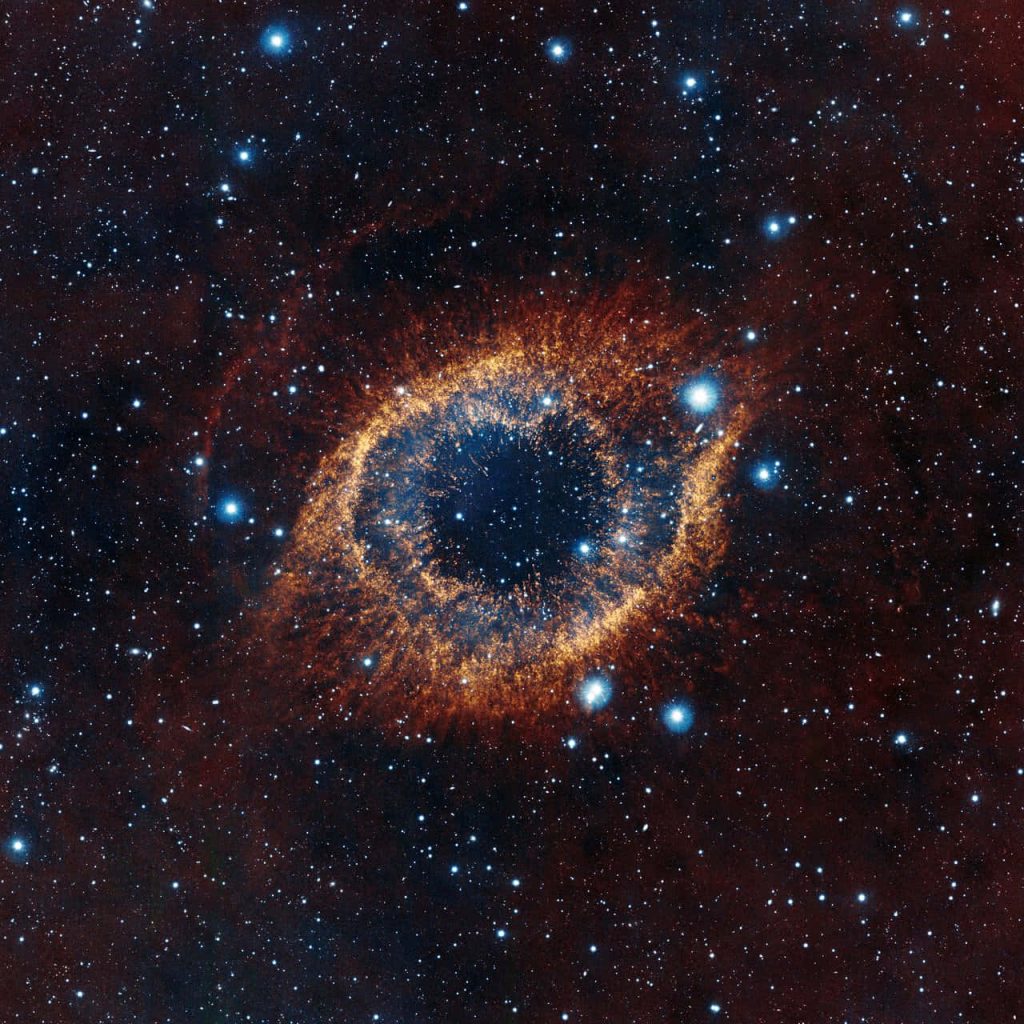 Helix Nebula glowing orange iris with dark center in vibrant star-filled cosmic space wallpaper