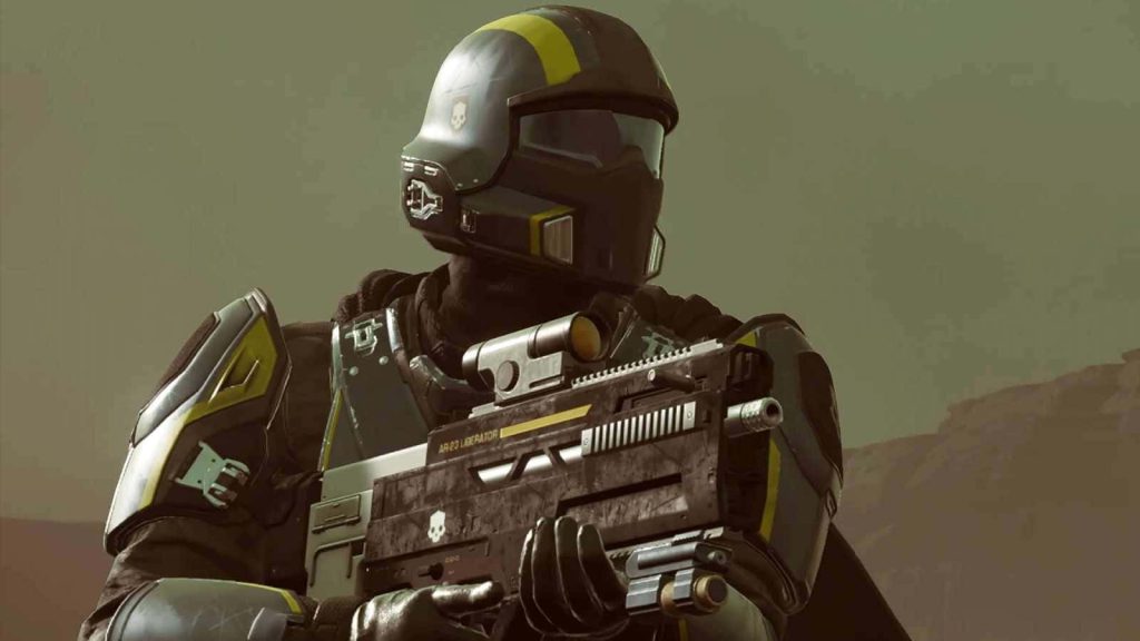 Helldivers 2 wallpaper showing armed Helldiver in black yellow armor with AR-23 Liberator in dusty alien battlefield