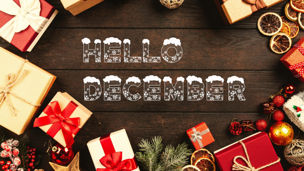 Festive Hello December wallpaper with snow-topped letters wrapped gifts pine branches and ornaments