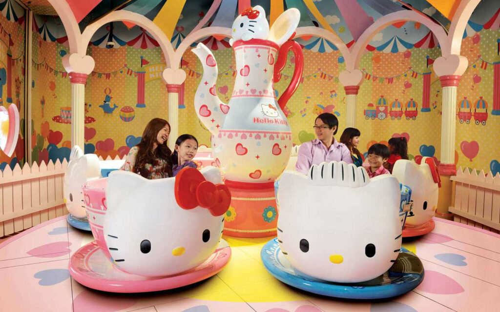 Hello Kitty Amusement Park Wallpaper: Colorful, Fun Teacup Ride