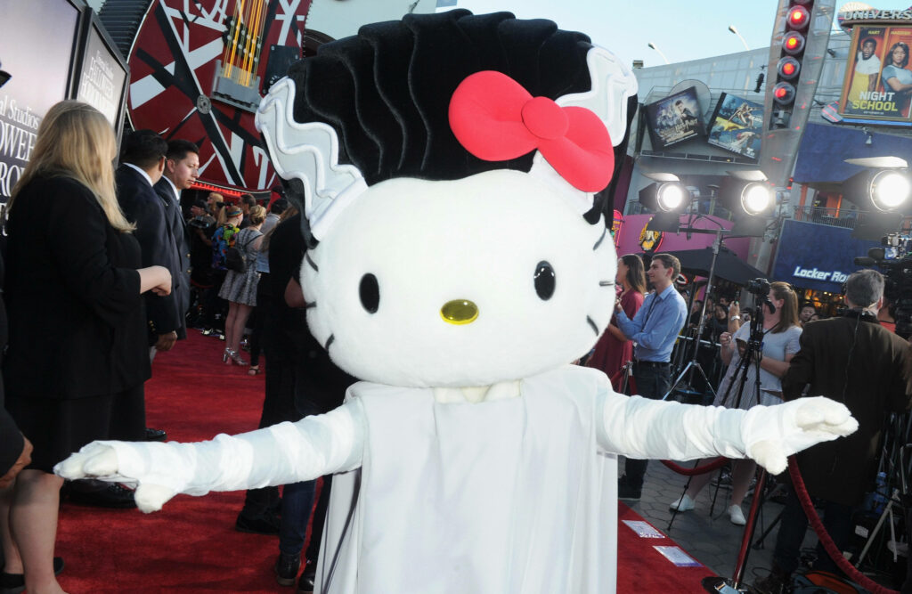 Hello Kitty in Halloween Mummy Costume at Festive Event Wallpaper