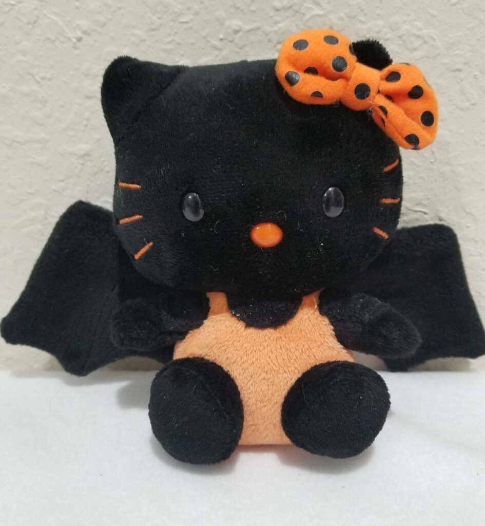 Hello Kitty Halloween Wallpaper: Plush Bat Costume Design