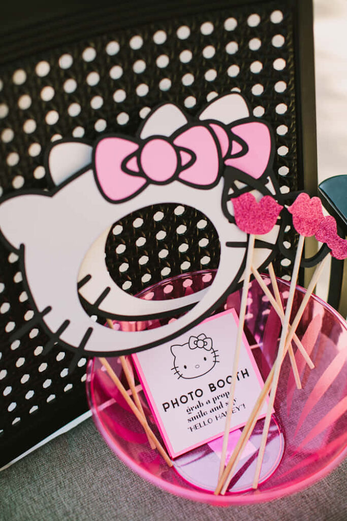Charming Hello Kitty Party Wallpaper with Fun Photo Booth Setup