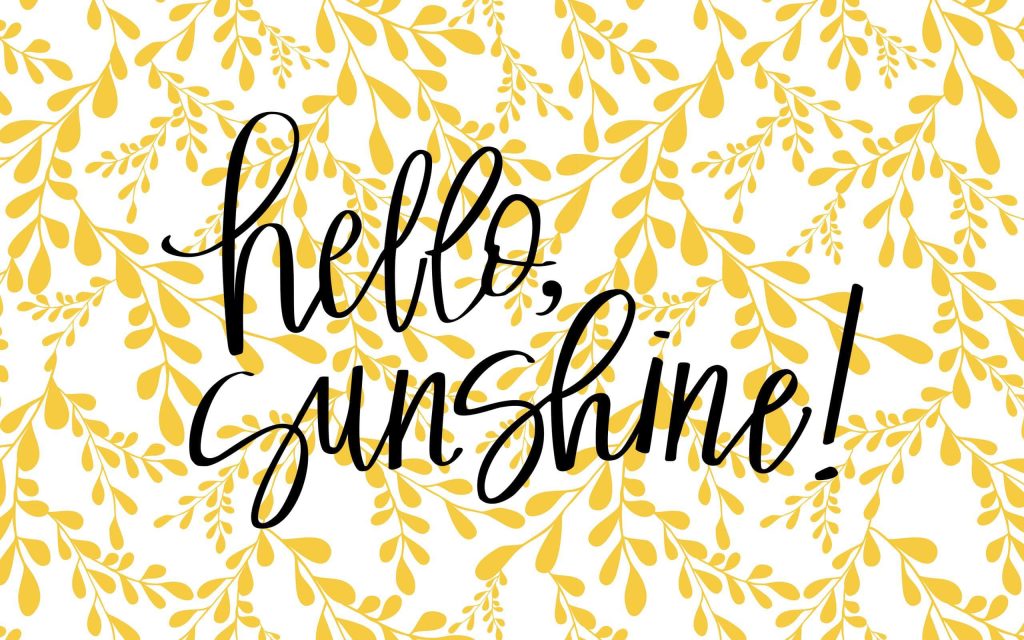 Hello Sunshine wallpaper with black cursive text and yellow botanical leaf pattern on white background