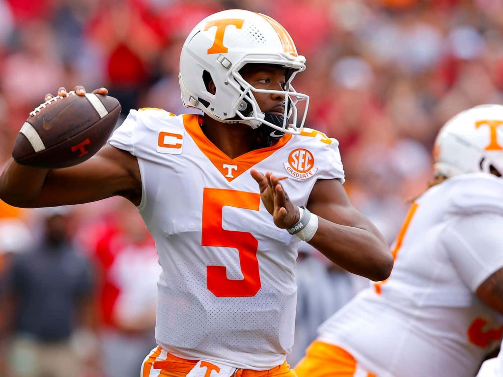 Hendon Hooker throwing pass in white jersey number 5 Tennessee Volunteers game wallpaper