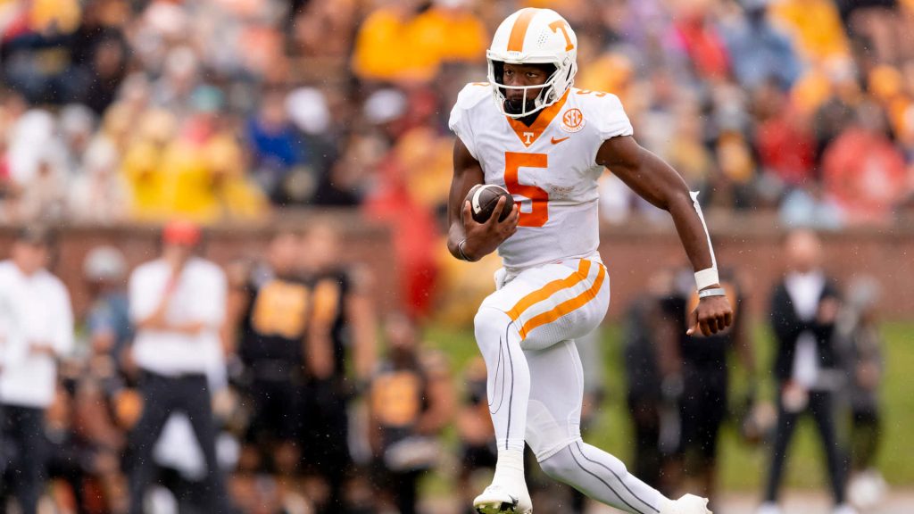 Tennessee Volunteers Hendon Hooker sprinting in white No 5 uniform football action wallpaper