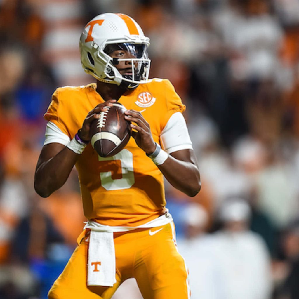 Hendon Hooker Tennessee Volunteers football action wallpaper in bright stadium lights background
