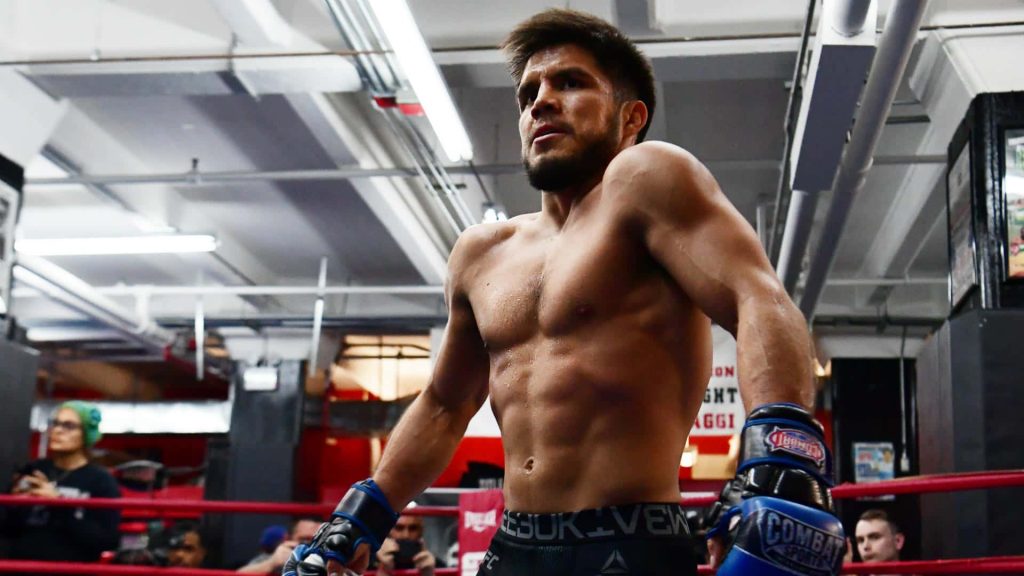 Henry Cejudo intense UFC workout blue gloves red boxing ring Gleasons Gym vibrant wallpaper
