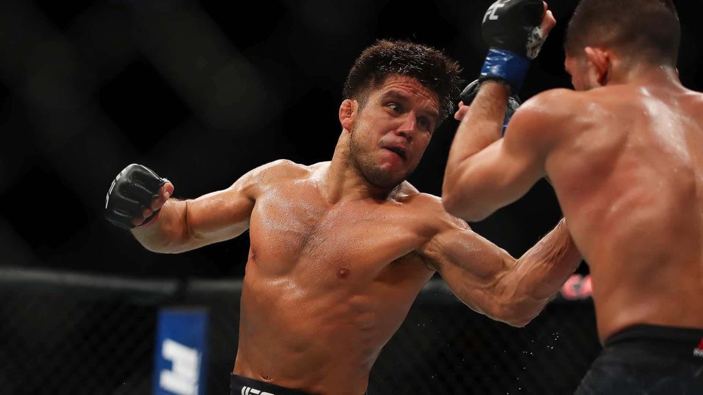 Henry Cejudo intense UFC 218 Octagon action shot Olympic gold MMA wallpaper background