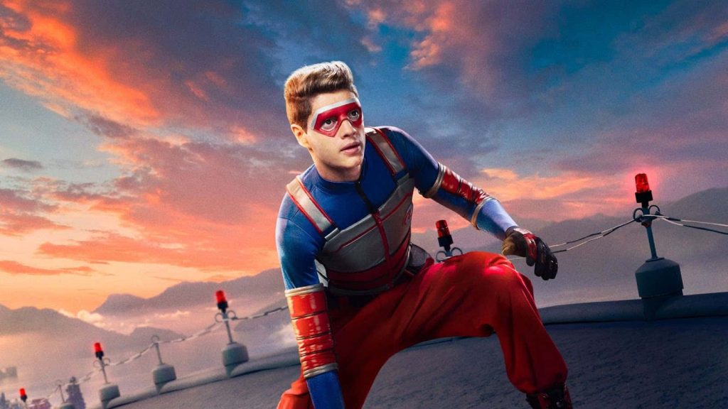 Henry Danger Kid Danger in red blue suit on rooftop at colorful sunset with glowing red beacons Wallpaper